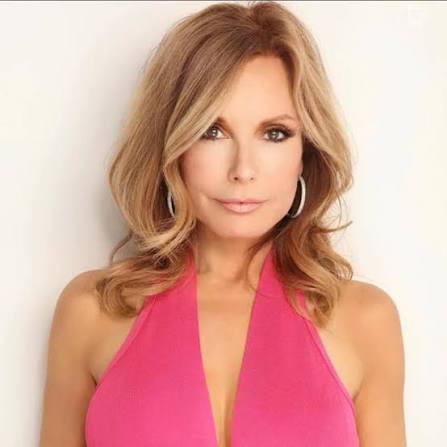 Tracey E. Bregman wearing a bright pink outfit